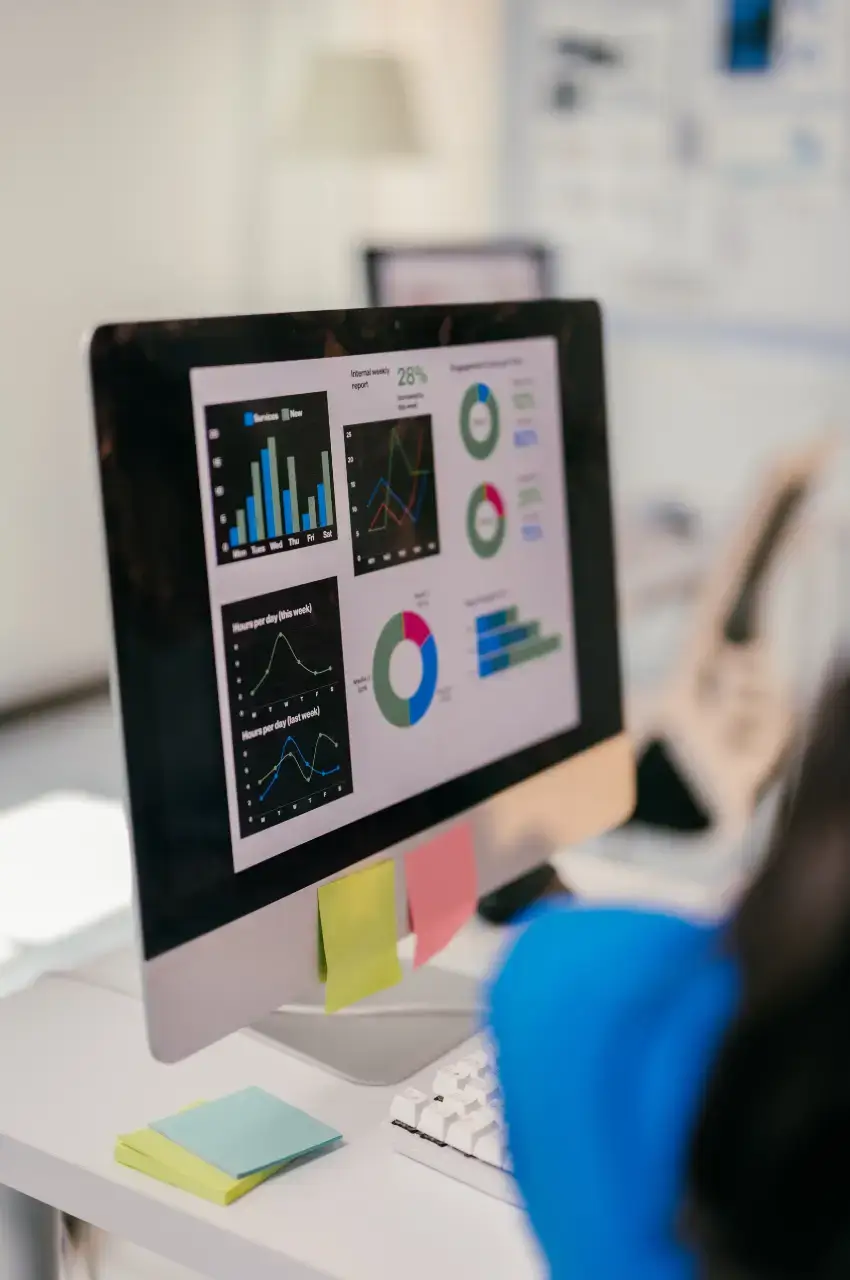 SEO content performance tracking dashboard with traffic analytics and ranking results on desktop monitor